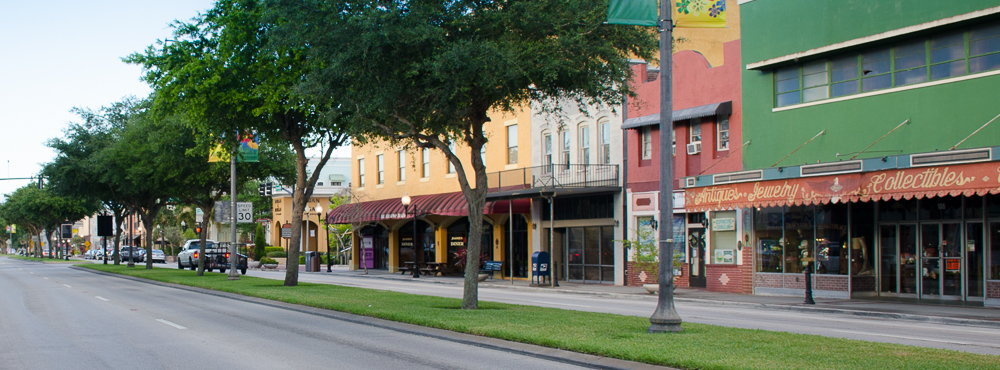 a building with a store on the corner of a street