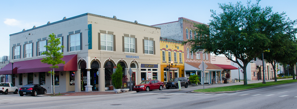 a building with a store on the side of a road