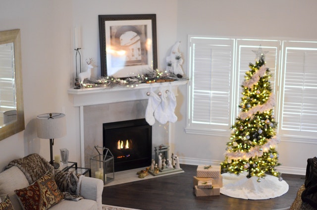 a living room filled with furniture and a fire place