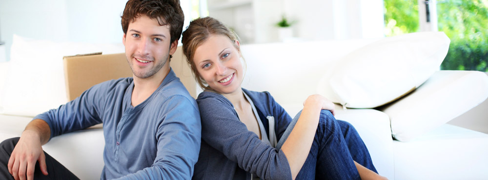 a man and a woman smiling for the camera